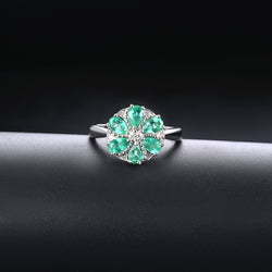 Pear-Cut Emerald Ring with Central White Zircon and Surrounding Emeralds - Shop Now!