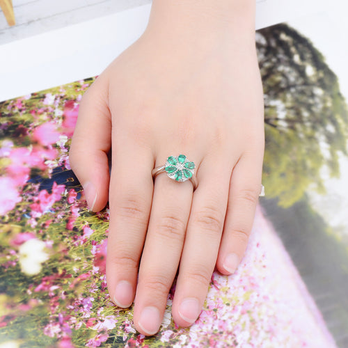 Pear-Cut Emerald Ring with Central White Zircon and Surrounding Emeralds - Shop Now!
