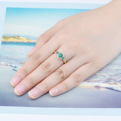 Three Stone Emerald and Gold Ring.