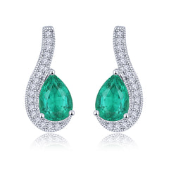 White Gold and Pear shape Emerald Earrings.