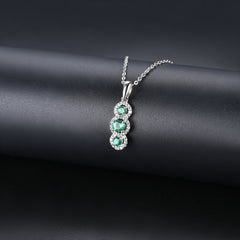 Three Emerald Stone and Diamond Pendant in Silver.