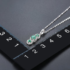 Three Emerald Stone and Diamond Pendant in Silver.