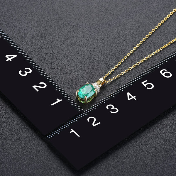 Oval Shape Emerald and Diamond Pendant.
